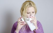 woman-blowing-nose